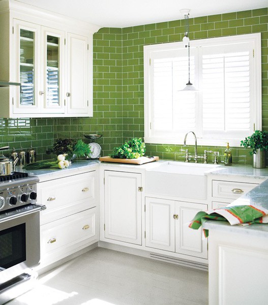 White painted cabinets with green backsplash